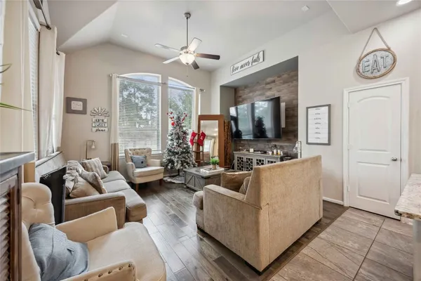 a living room with furniture and a flat screen tv
