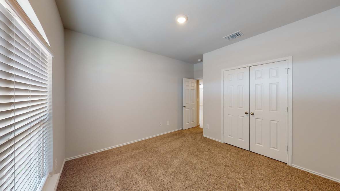300 Creekfall Road Burnet, TX 78611 - Photo 15 of 23 a view of an empty room and window