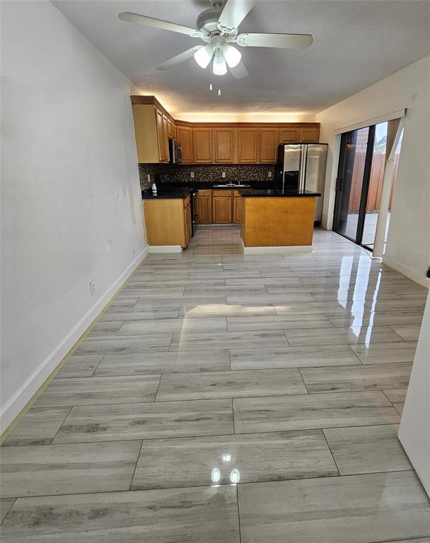 a view of a living room with furniture and chandelier