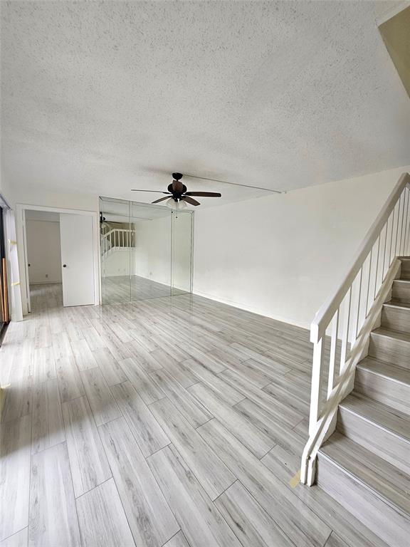912 Springdale Circle, Unit 912 Palm Springs, FL 33461 - Photo 2 of 15 wooden floor in an empty room with a window