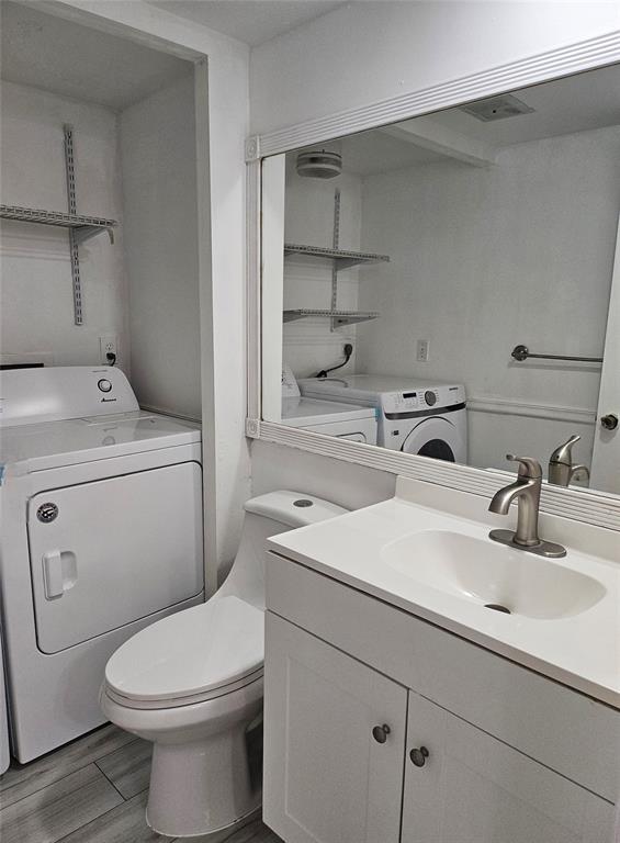 912 Springdale Circle, Unit 912 Palm Springs, FL 33461 - Photo 5 of 15 a bathroom with a sink toilet and a mirror