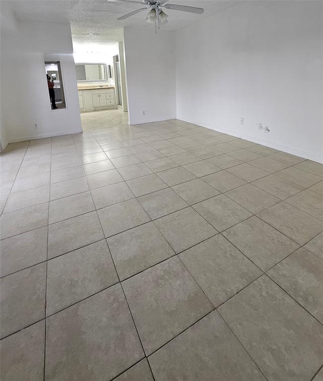 912 Springdale Circle, Unit 912 Palm Springs, FL 33461 - Photo 9 of 15 a view of a livingroom and window