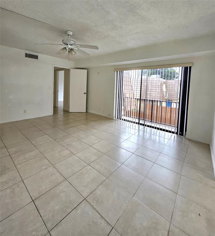 912 Springdale Circle, Unit 912 Palm Springs, FL 33461 - Photo 10 of 15 a view of an empty room and a window