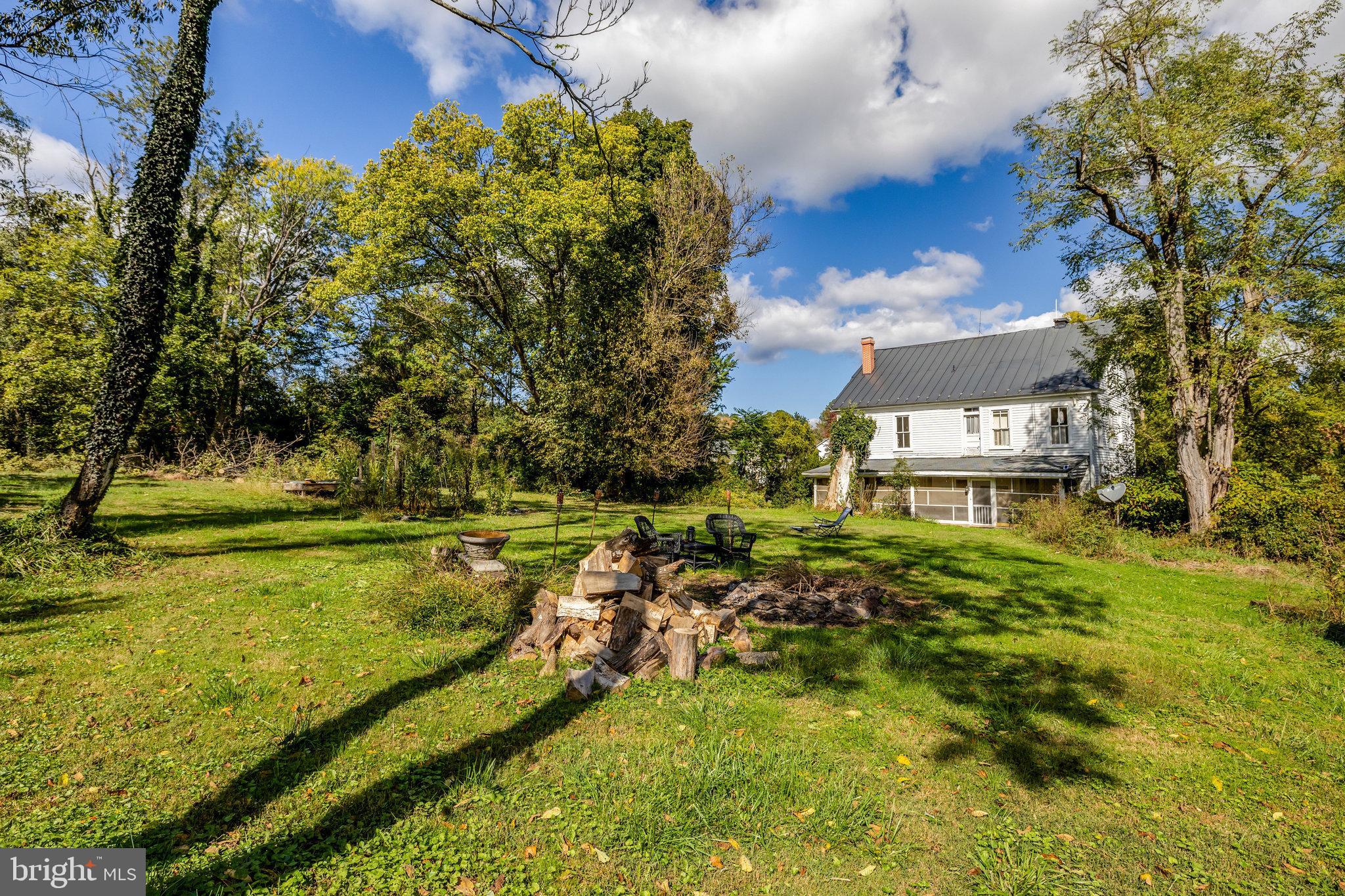 39 New Cut Road Round Hill, VA 20141 - Photo 20 of 33 a view of a large yard with plants and large trees