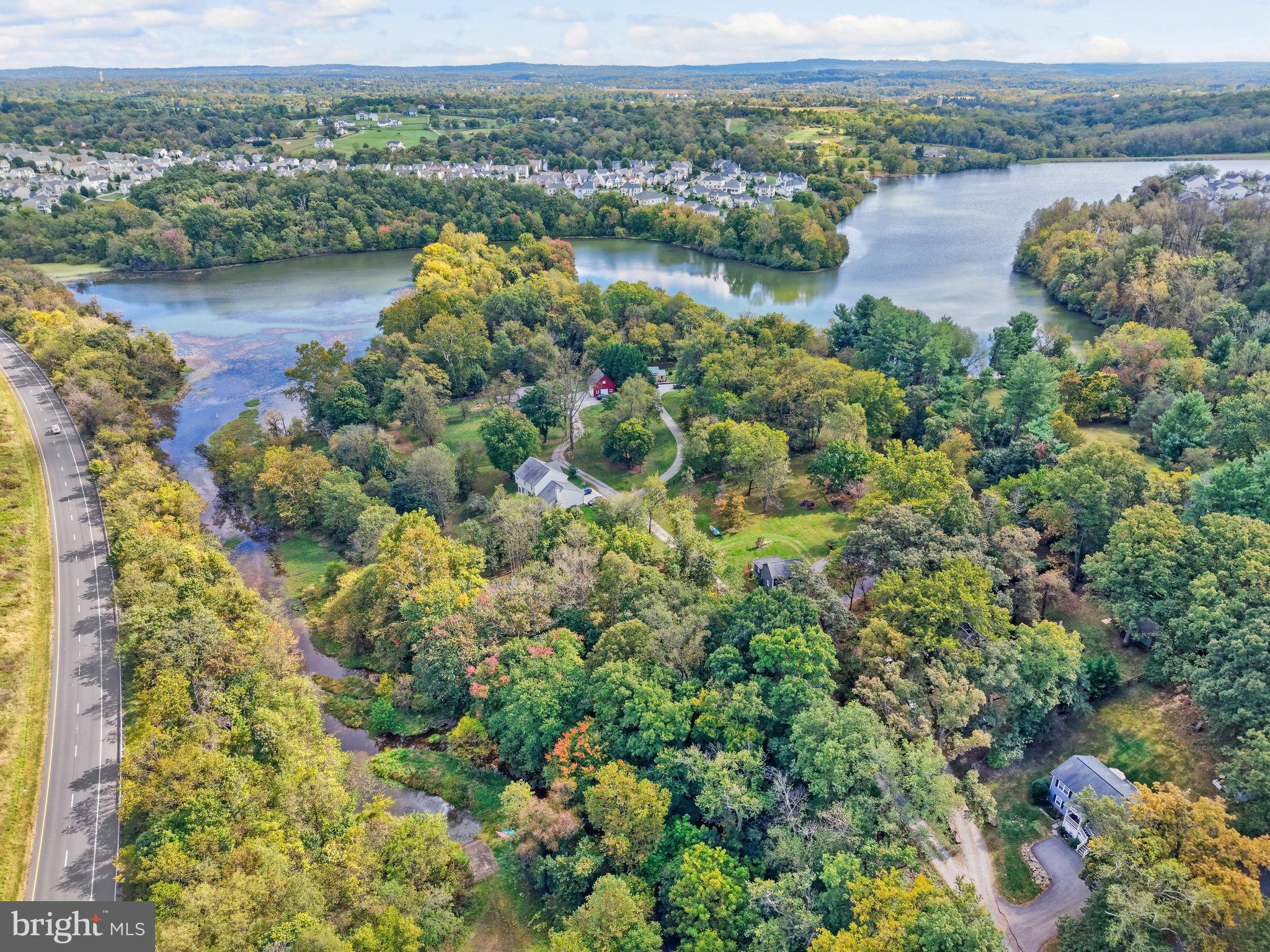 39 New Cut Road Round Hill, VA 20141 - Photo 27 of 33 a view of a lake with houses in the back