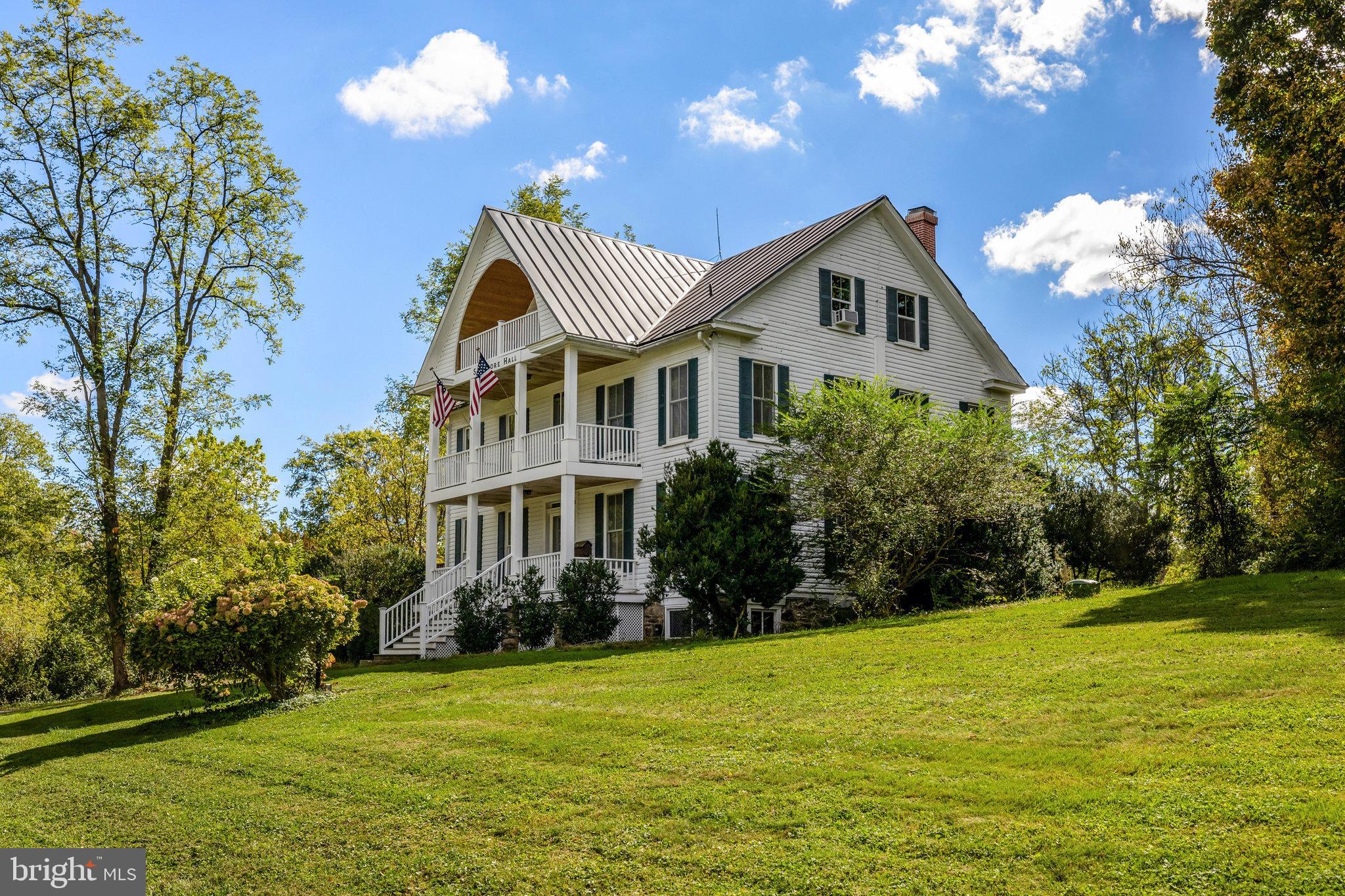 39 New Cut Road Round Hill, VA 20141 - Photo 32 of 33 a front view of a house with a yard and trees
