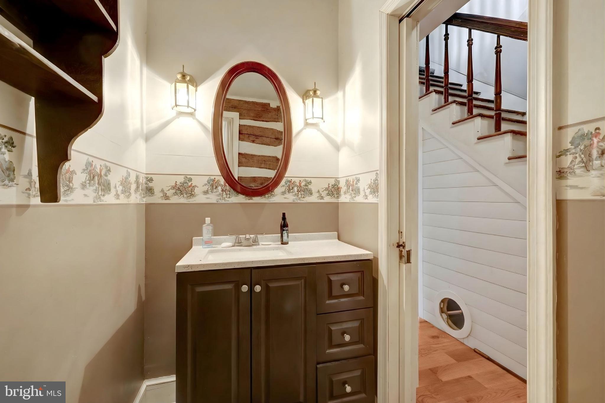 39 New Cut Road Round Hill, VA 20141 - Photo 10 of 33 a bathroom with a sink and a mirror