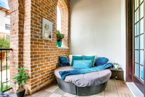 a bedroom with a large bed and a large window