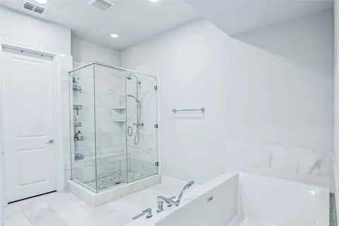 a bedroom with bed and window