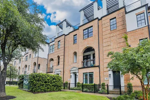 a view of a brick house with a large window