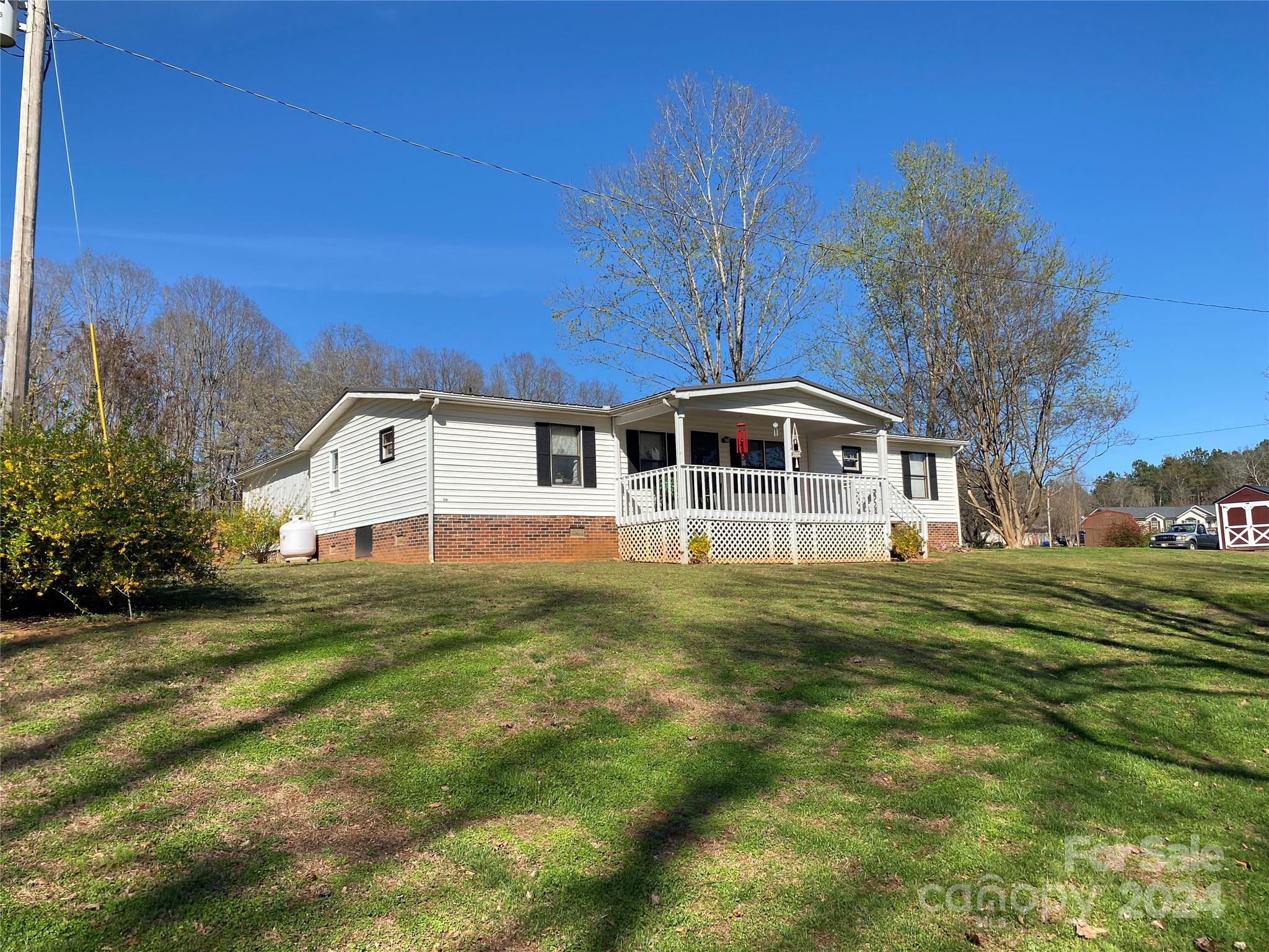 1715 Hopewell Church Road Hiddenite, NC 28636 - Photo 1 of 46 a front view of a house with a yard