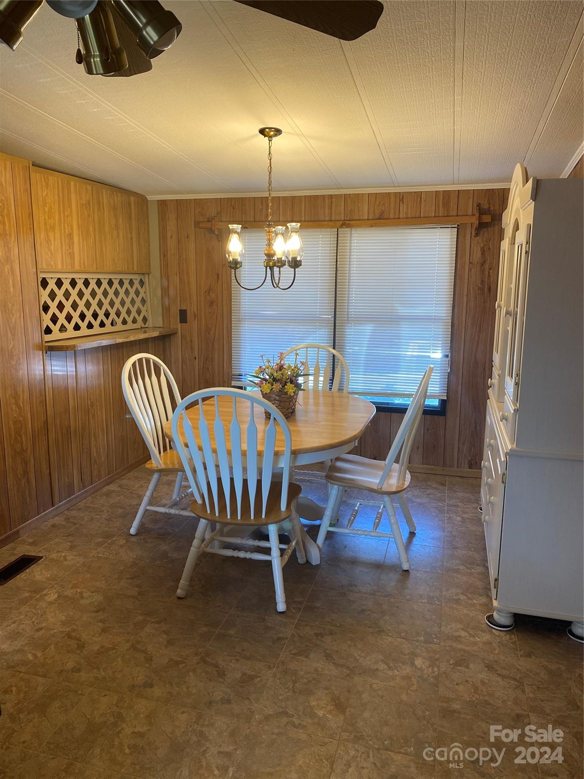 1715 Hopewell Church Road Hiddenite, NC 28636 - Photo 17 of 46 a dining room with furniture and wooden floor