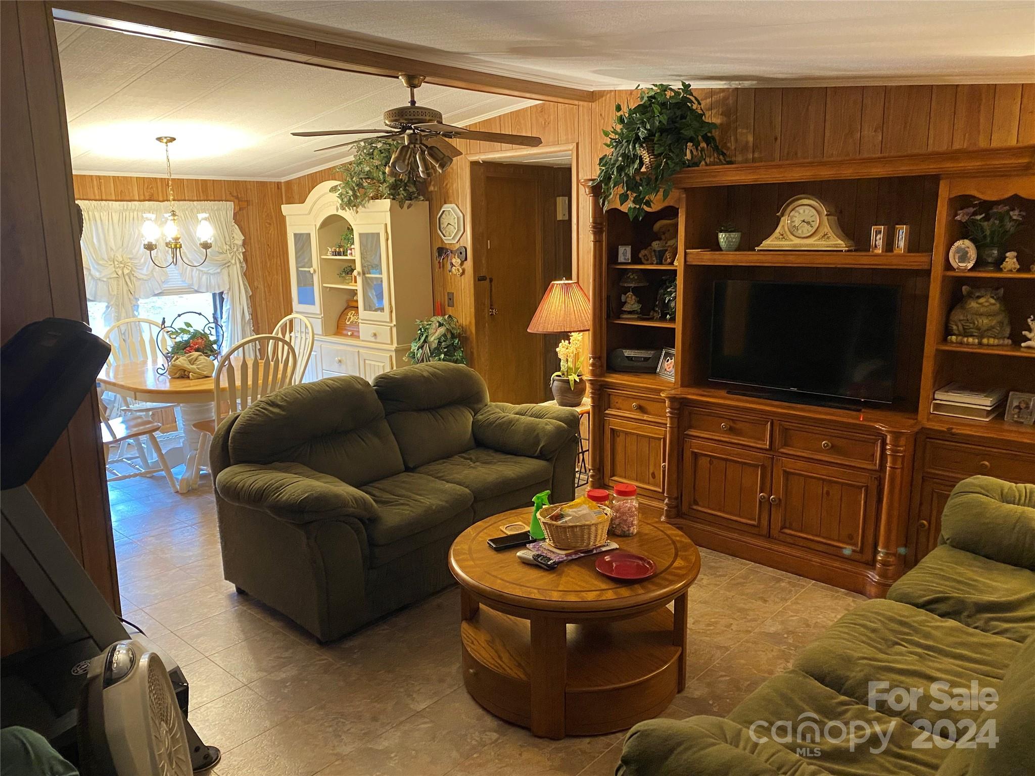 1715 Hopewell Church Road Hiddenite, NC 28636 - Photo 18 of 46 a living room with furniture and a flat screen tv