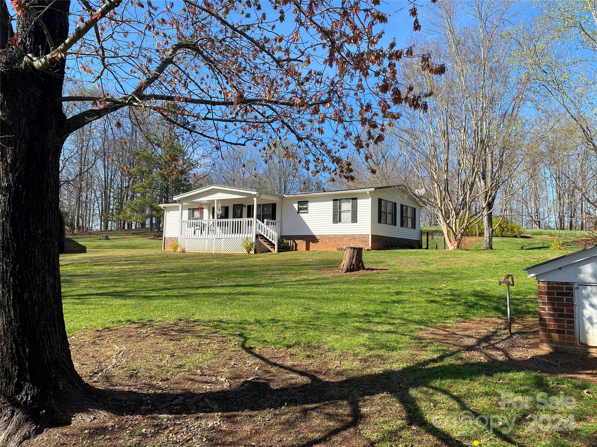 1715 Hopewell Church Road Hiddenite, NC 28636 - Photo 2 of 46 a view of a house with a yard