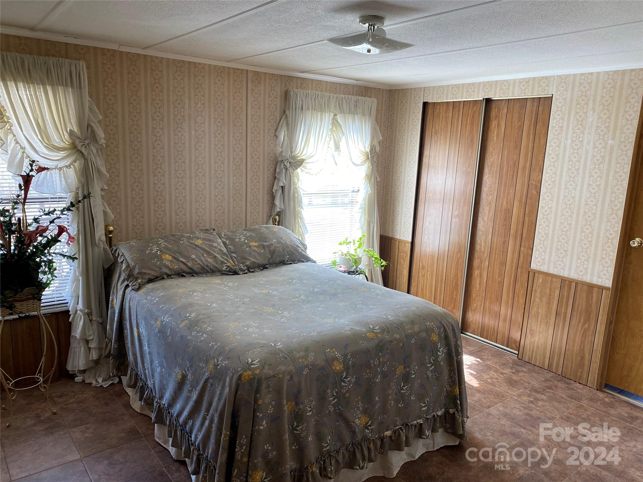 1715 Hopewell Church Road Hiddenite, NC 28636 - Photo 26 of 46 a bedroom with a bed and a window