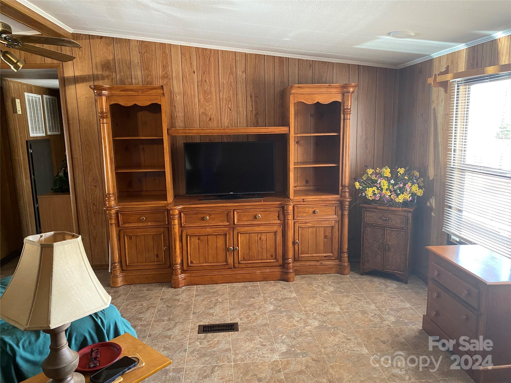 1715 Hopewell Church Road Hiddenite, NC 28636 - Photo 35 of 46 a living room with furniture and a flat screen tv