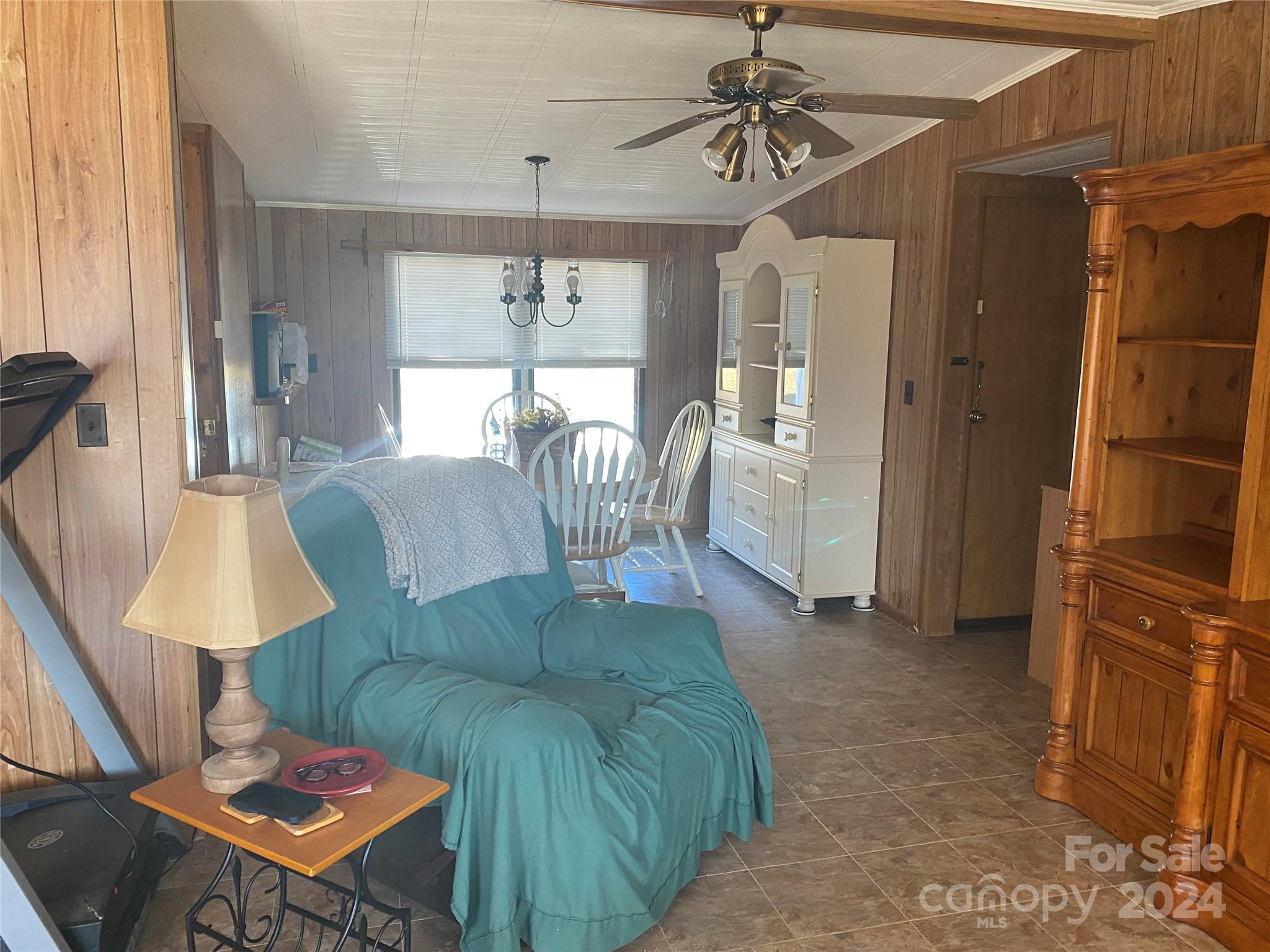 1715 Hopewell Church Road Hiddenite, NC 28636 - Photo 37 of 46 a living room with furniture and a table