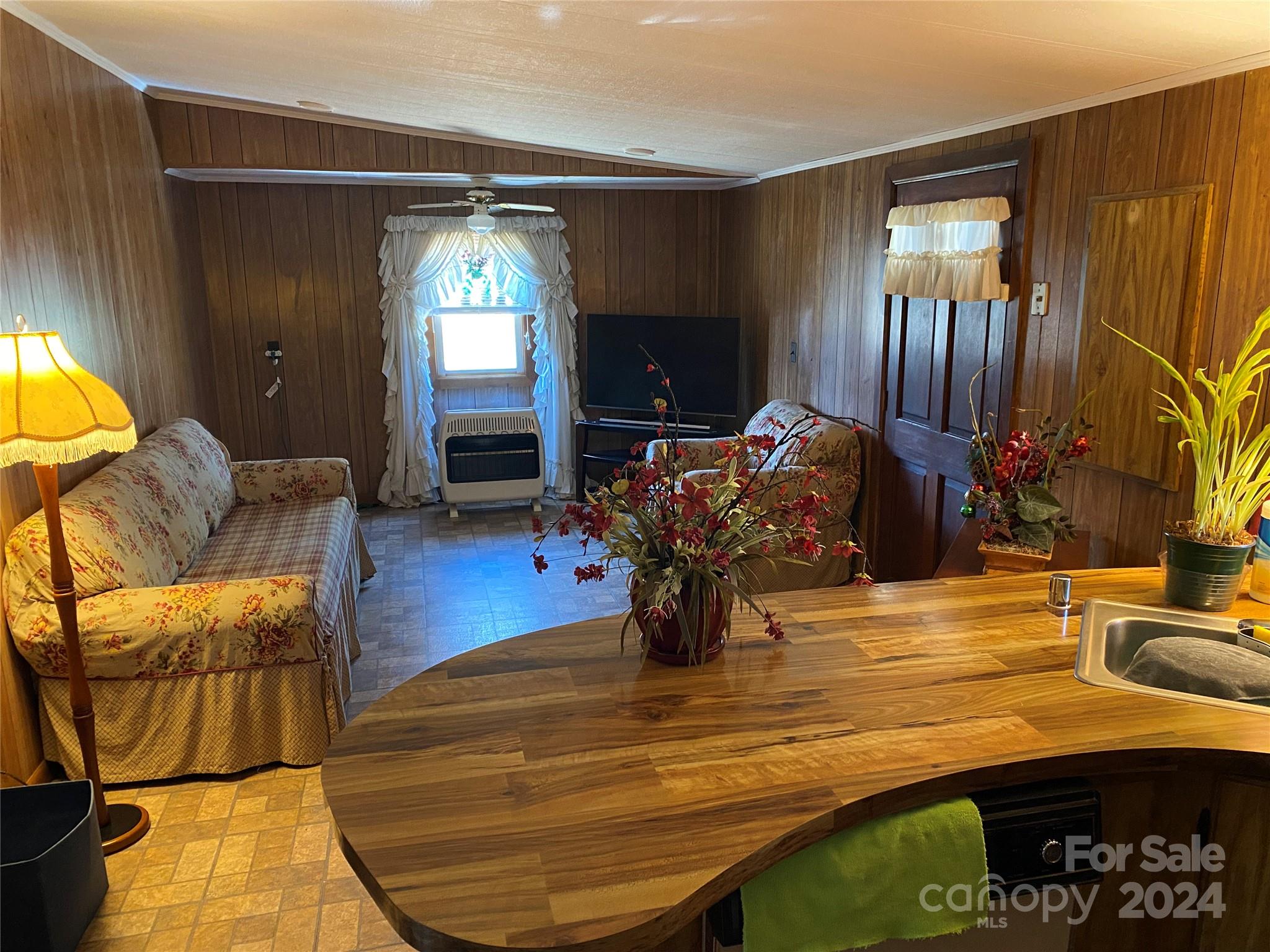 1715 Hopewell Church Road Hiddenite, NC 28636 - Photo 6 of 46 a dining room with furniture and wooden floor