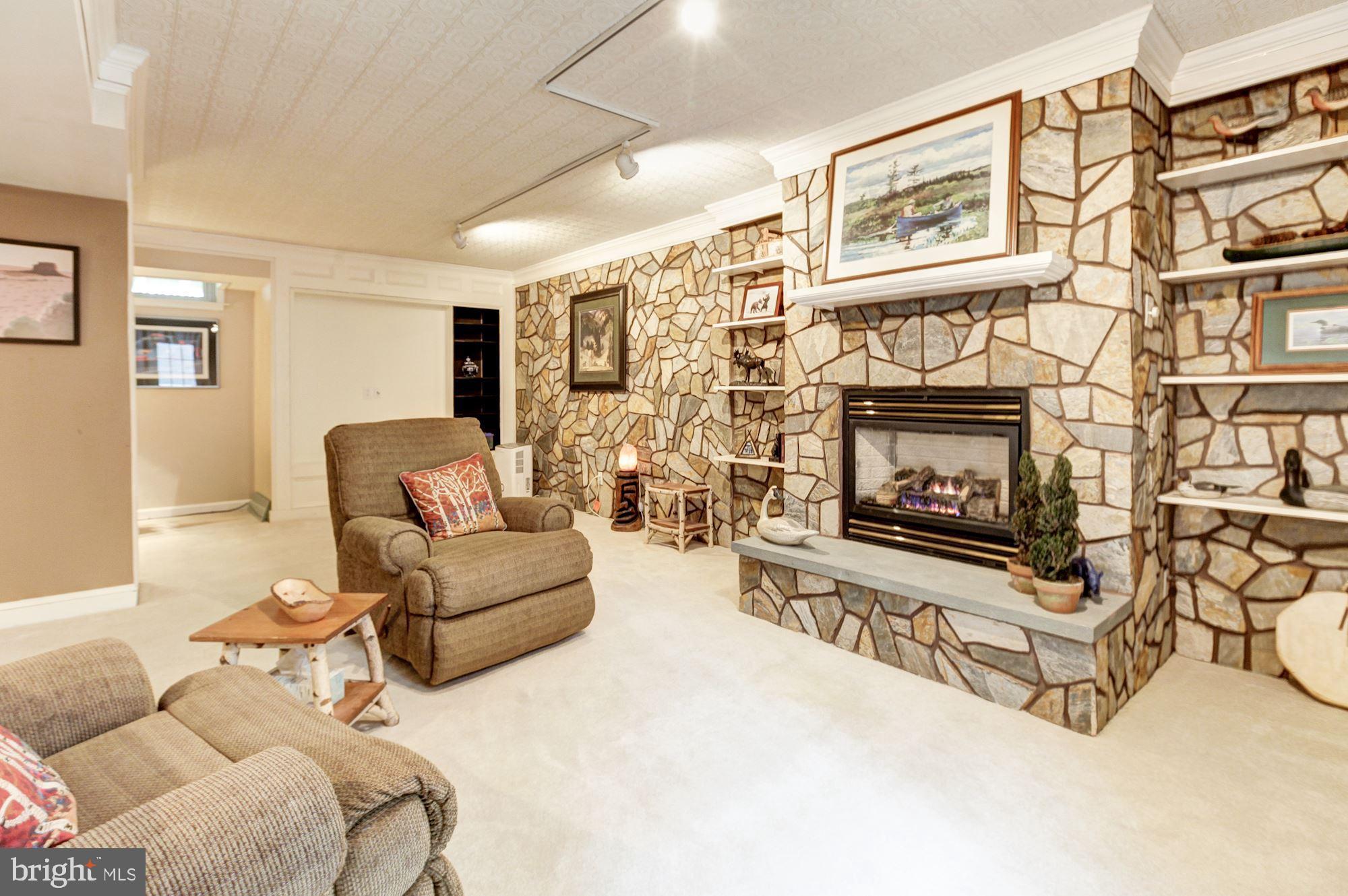 1607 Rolling Road Bel Air, MD 21014 - Photo 35 of 49 Gas Fireplace with Stone Surround