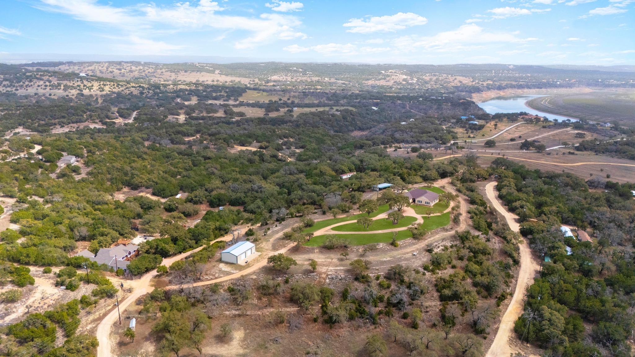 28701 Valley Road Marble Falls, TX 78654 - Photo 32 of 35 an aerial view of residential houses with outdoor space