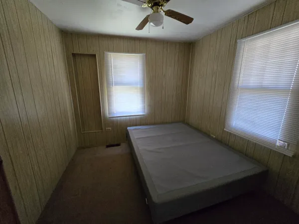 a view of a livingroom with furniture and windows
