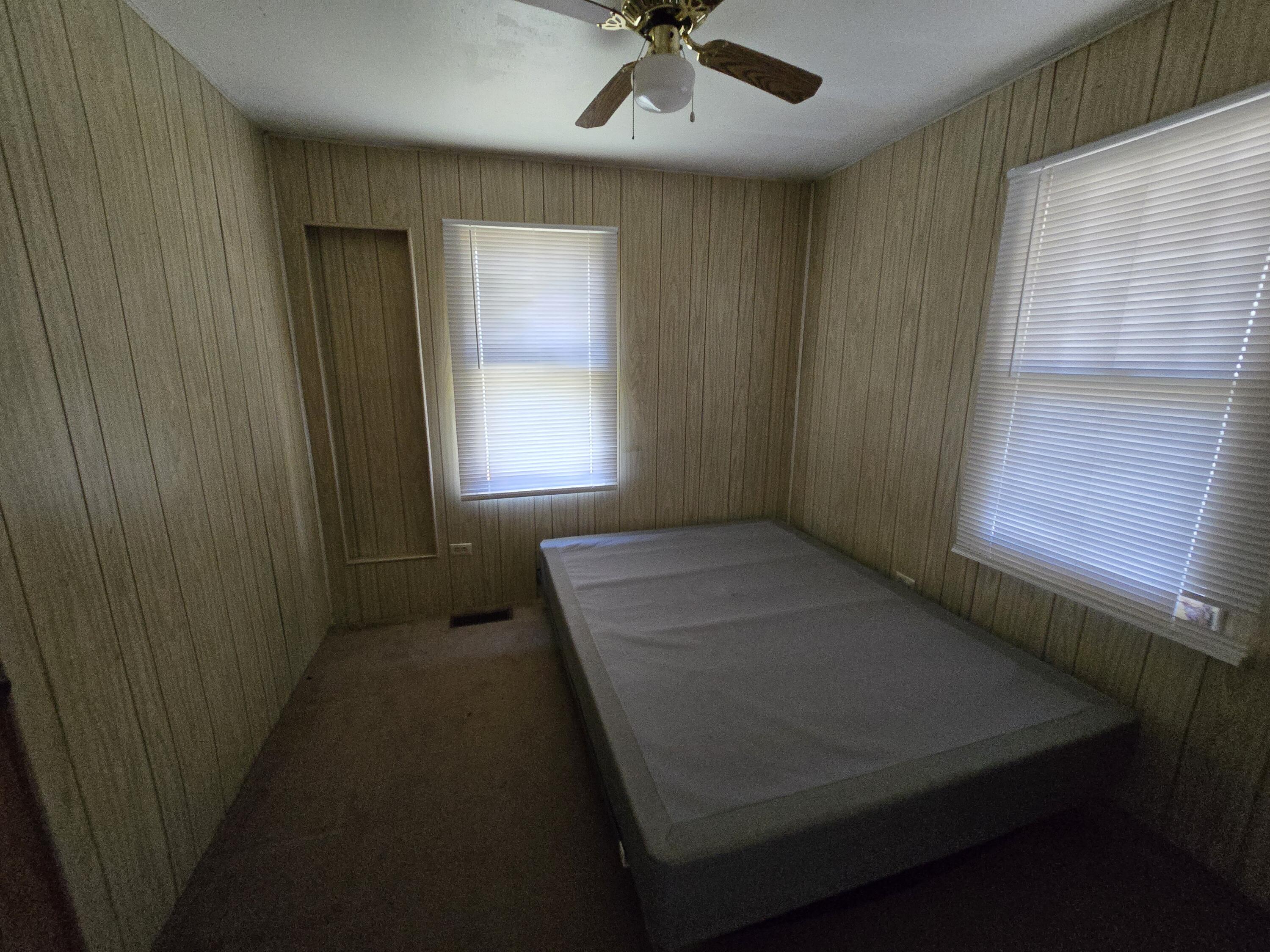 1006 Nassau Plainview, TX 79072 - Photo 3 of 10 a view of an empty room with a window