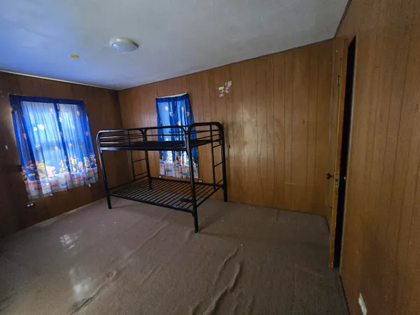 a bathroom with a granite countertop toilet a sink and a shower