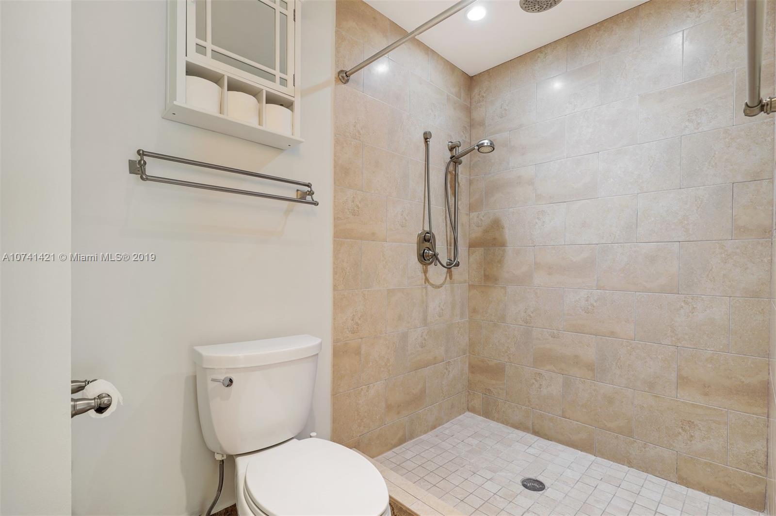 15041 Southwest 96th Terrace Miami, FL 33196 - Photo 15 of 16 a bathroom with a toilet and a shower