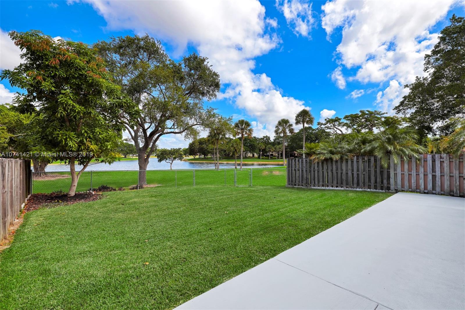 15041 Southwest 96th Terrace Miami, FL 33196 - Photo 16 of 16 a view of a park with large trees