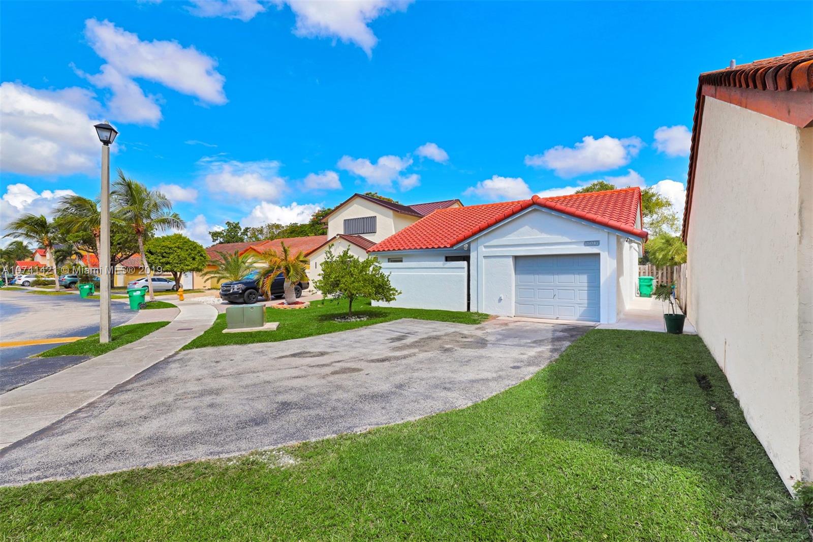 15041 Southwest 96th Terrace Miami, FL 33196 - Photo 2 of 16 a view of a house with a yard and entertaining space