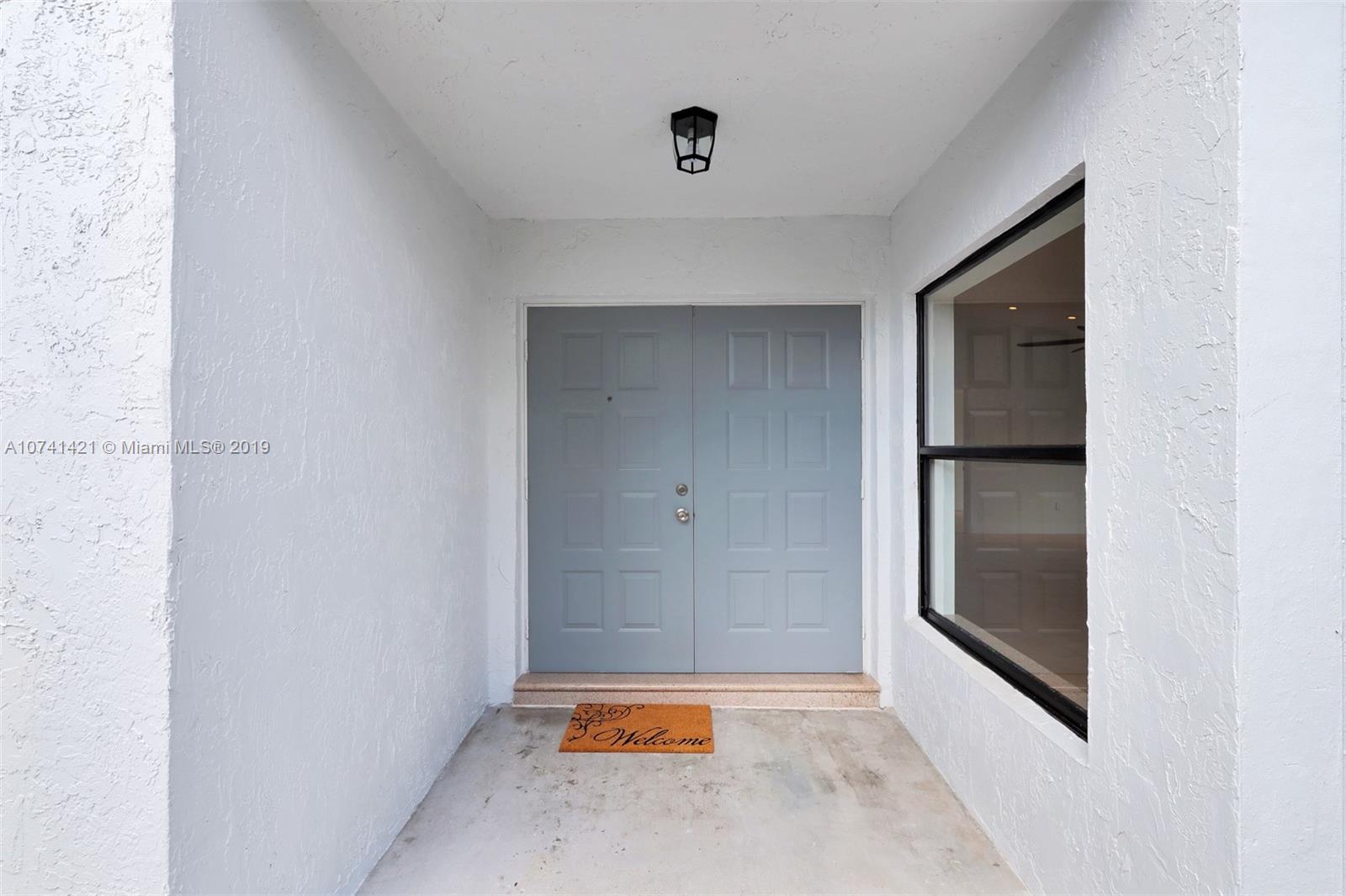15041 Southwest 96th Terrace Miami, FL 33196 - Photo 3 of 16 a view of an empty room