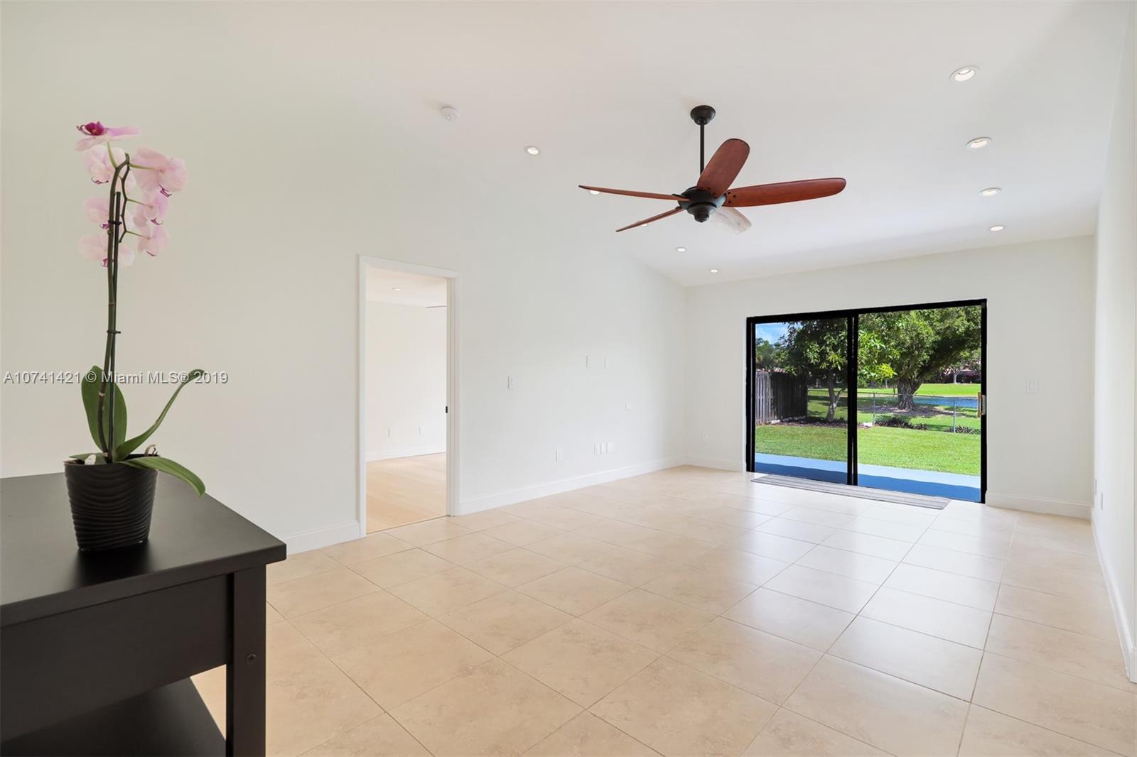 15041 Southwest 96th Terrace Miami, FL 33196 - Photo 4 of 16 a view of an empty room with a window