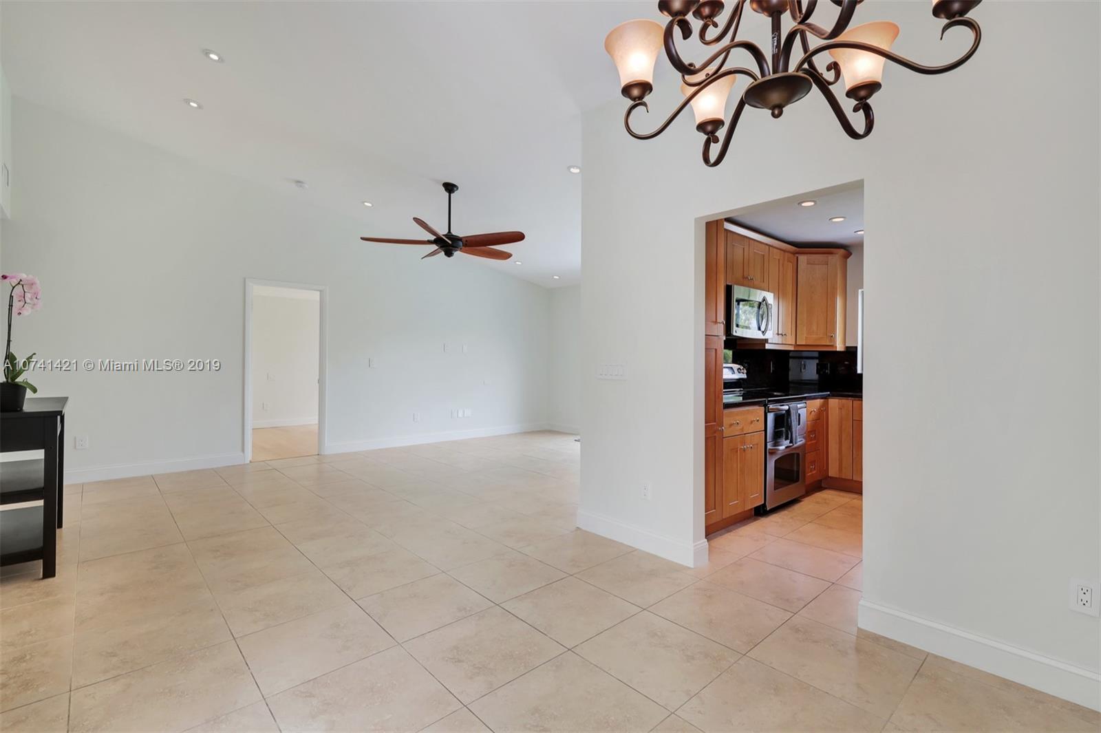 15041 Southwest 96th Terrace Miami, FL 33196 - Photo 5 of 16 a view of kitchen and an empty room