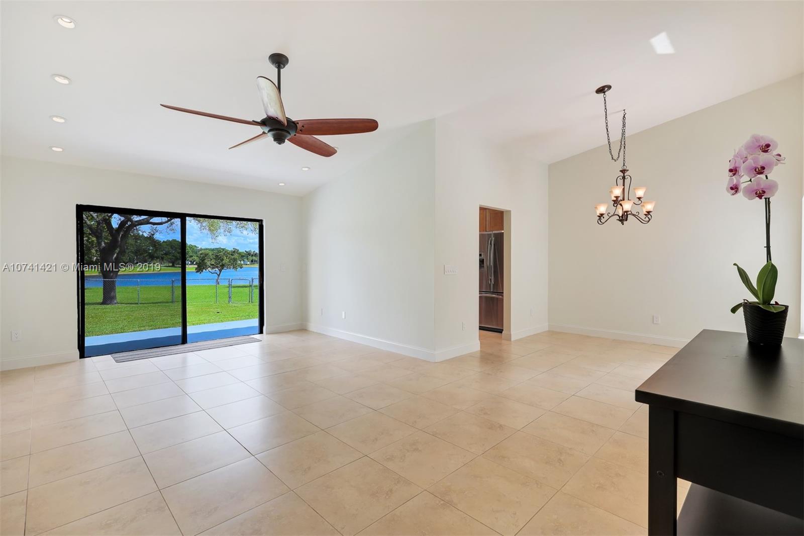 15041 Southwest 96th Terrace Miami, FL 33196 - Photo 6 of 16 a view of an empty room with a window