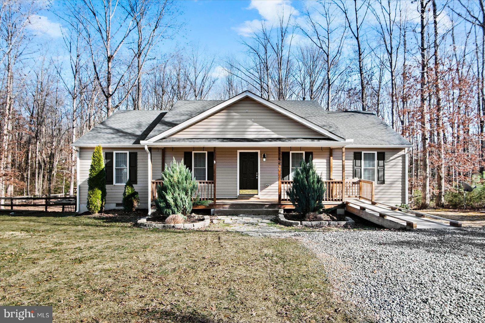 357 Winding Ridge Way Bumpass, VA 23024 - Photo 3 of 31 a front view of a house with lots of sitting space