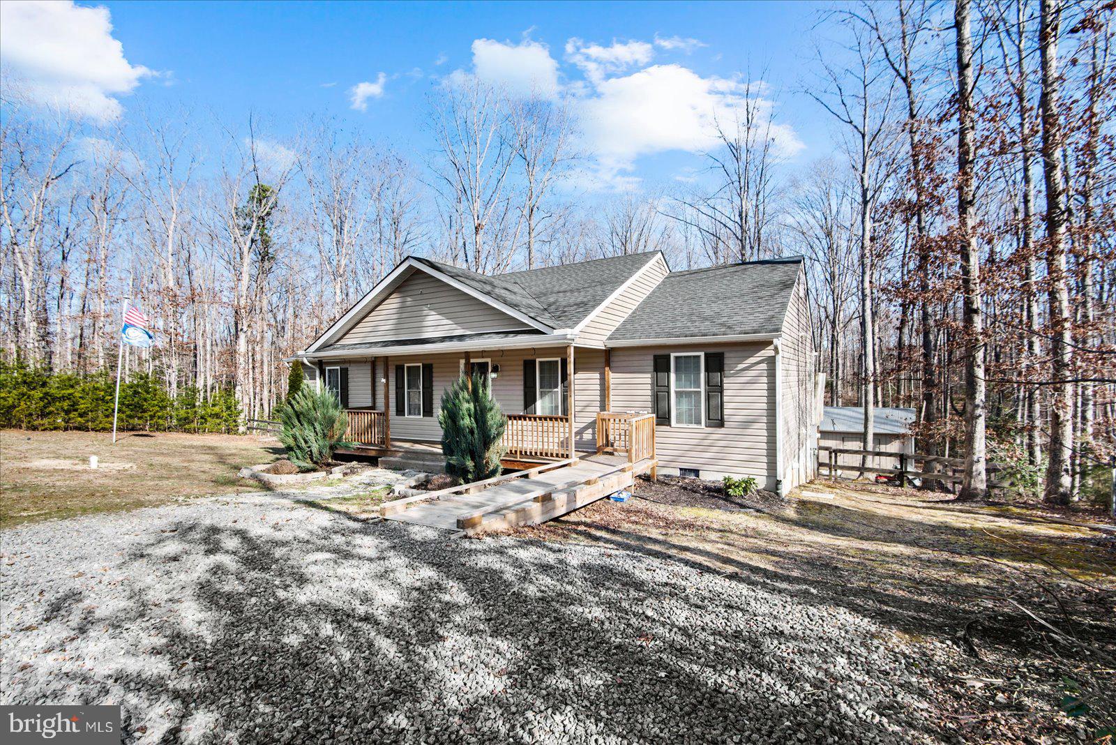 357 Winding Ridge Way Bumpass, VA 23024 - Photo 4 of 31 a view of a house with yard and sitting area