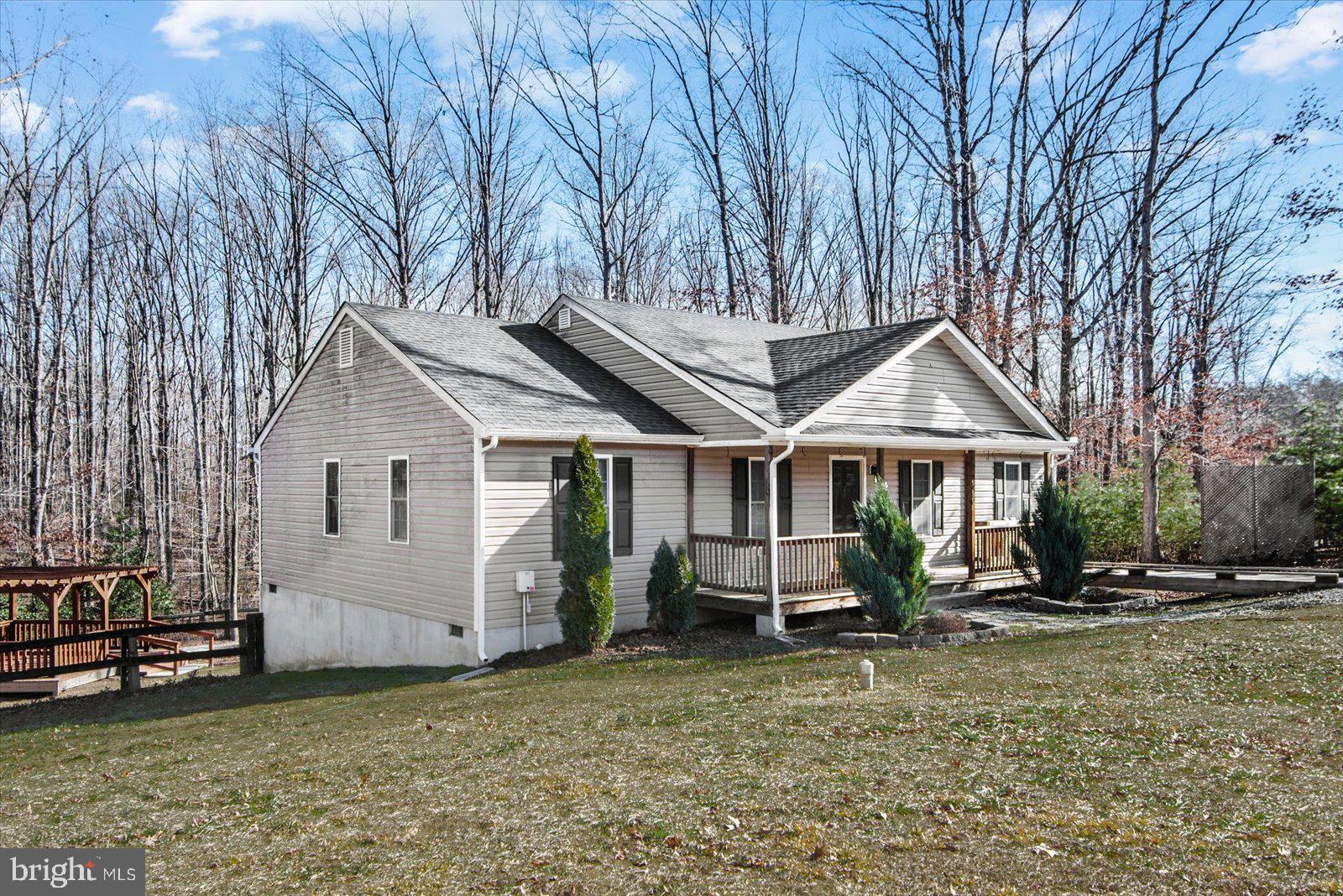 357 Winding Ridge Way Bumpass, VA 23024 - Photo 5 of 31 a front view of a house with a yard