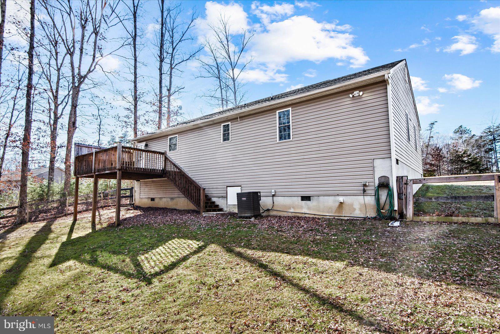 357 Winding Ridge Way Bumpass, VA 23024 - Photo 7 of 31 a view of a house with backyard and sitting area