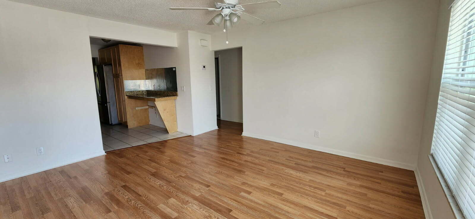 3831 Beacon Hill Road Jupiter, FL 33469 - Photo 3 of 9 a view of a kitchen from the hallway