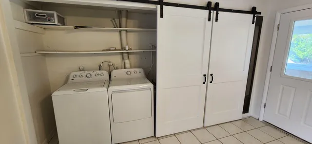 a utility room with dryer and washer