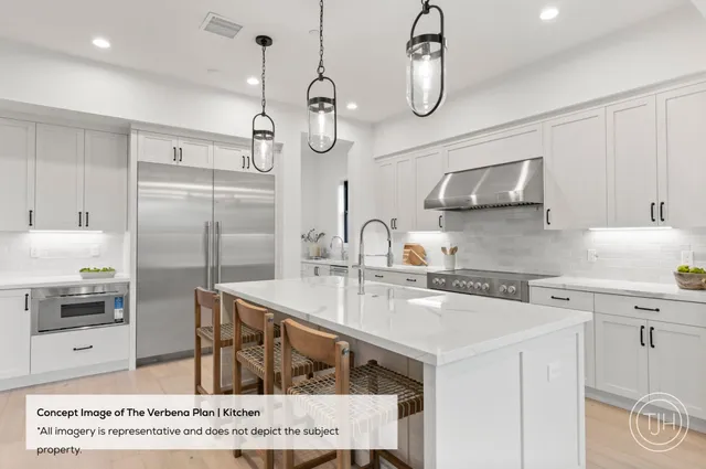 a kitchen with stainless steel appliances granite countertop a sink a stove and refrigerator