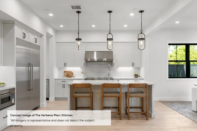 a kitchen with stainless steel appliances granite countertop a sink a refrigerator and a stove