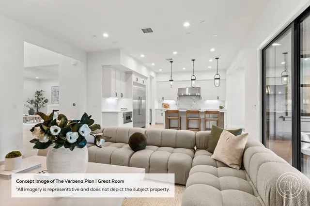 a living room with furniture kitchen view and a chandelier