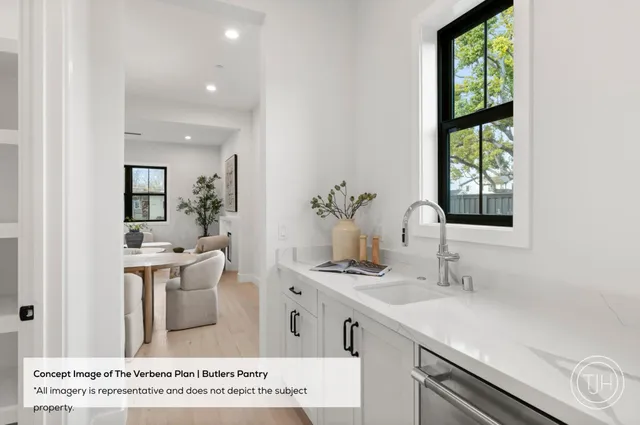 a view of kitchen with stainless steel appliances kitchen island sink and large window