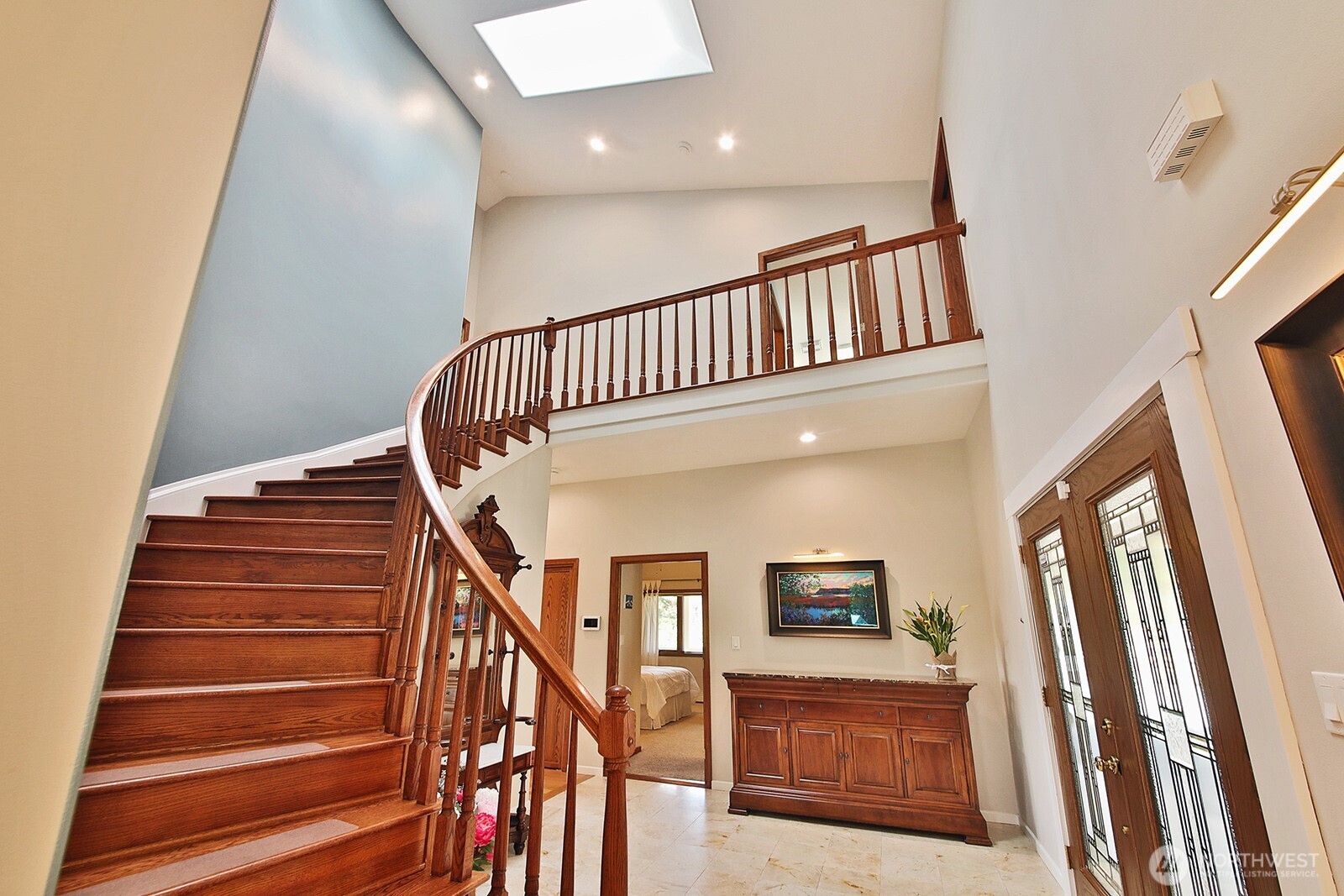 5741 Crow Haven Road Langley, WA 98260 - Photo 28 of 40 a view of staircase with lots of frames on wall and stairs