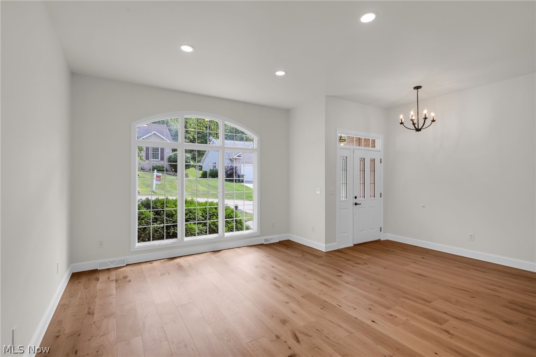 623 Bridgeview Avenue Chester, WV 26034 - Photo 3 of 47 Living room featuring hardwood floors and oversized windows