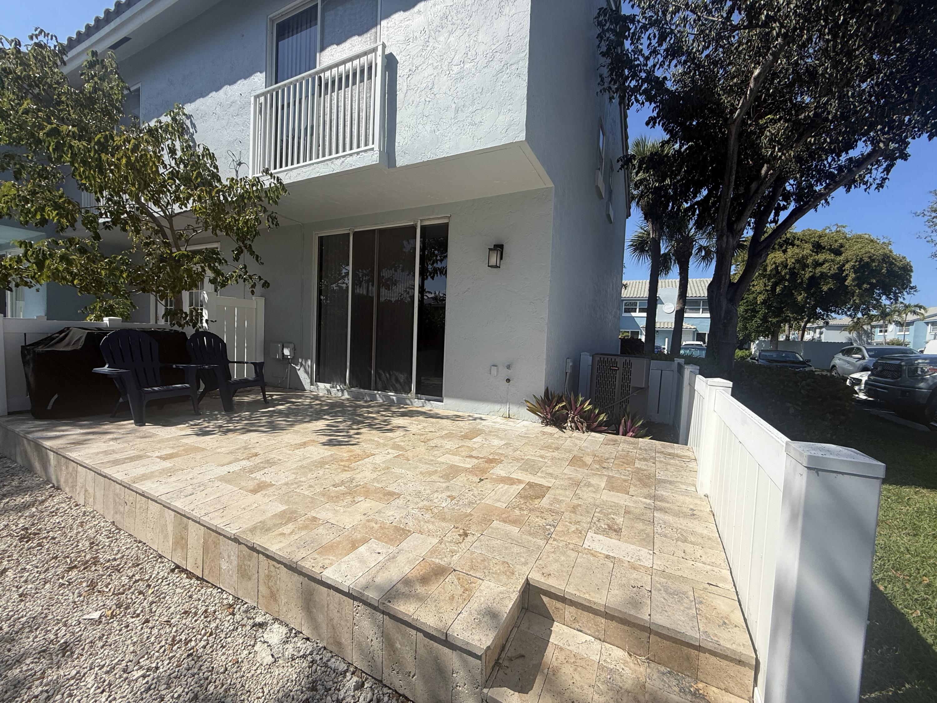 972 Jeffery Street Boca Raton, FL 33487 - Photo 14 of 16 a view of a house with snow on the road