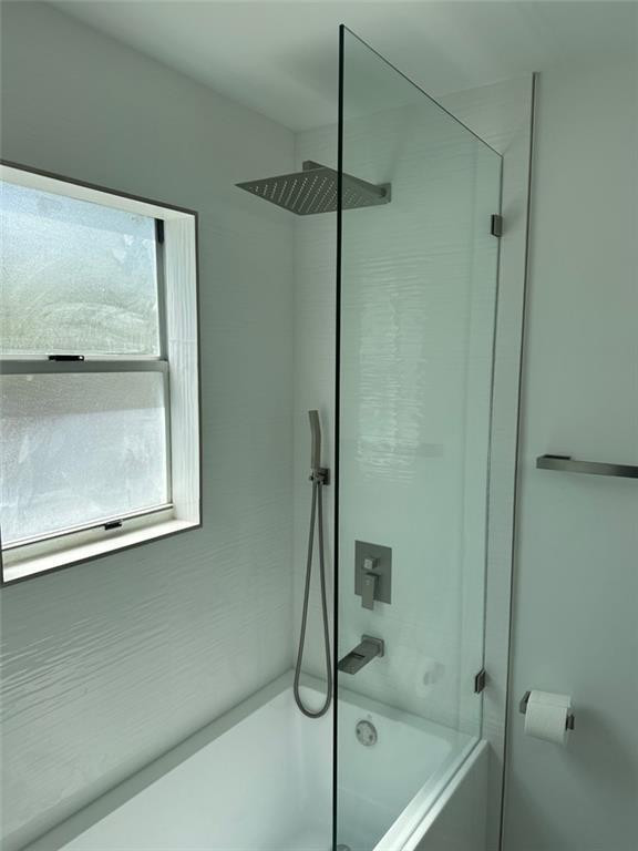 972 Jeffery Street Boca Raton, FL 33487 - Photo 15 of 18 a bathroom with a glass shower door
