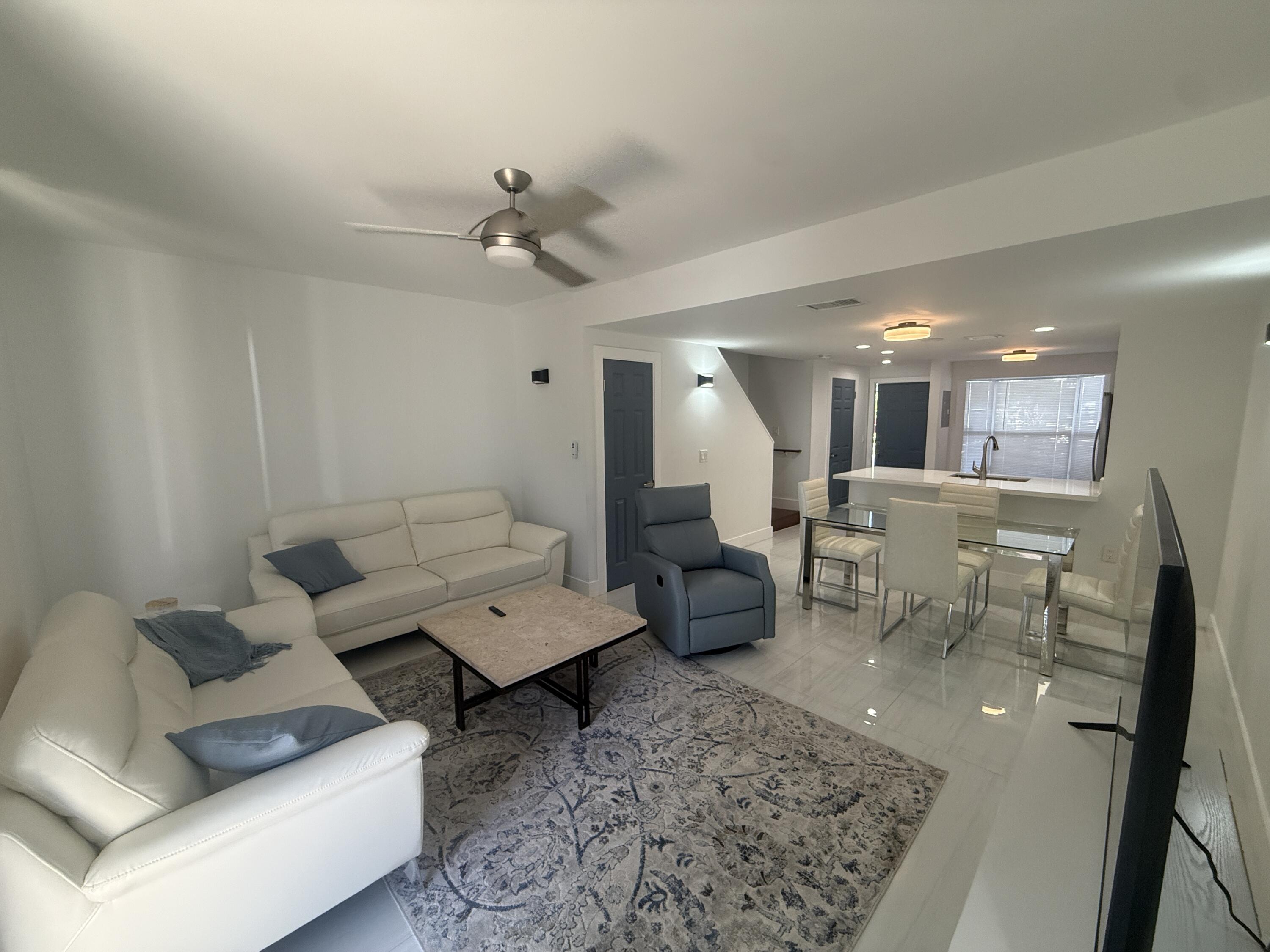 972 Jeffery Street Boca Raton, FL 33487 - Photo 4 of 16 a living room with furniture and a table
