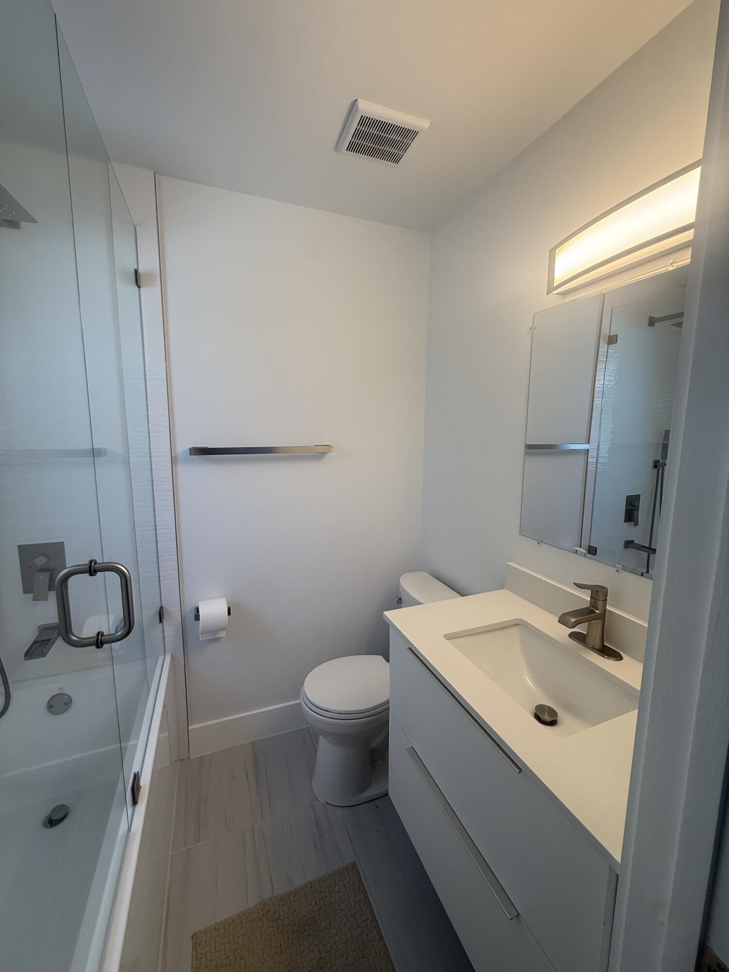 972 Jeffery Street Boca Raton, FL 33487 - Photo 6 of 16 a bathroom with a sink a toilet and shower